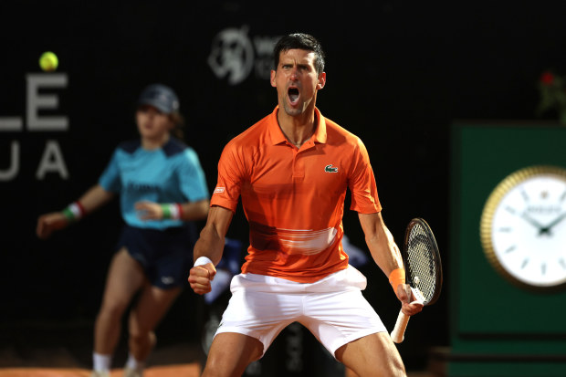 Novak Djokovic of Serbia celebrates a point in the Italian Open men's singles semi-final match against Casper Ruud of Norway.