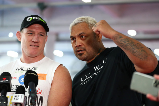 Mark Hunt interjects Paul Gallen during a media opportunity.