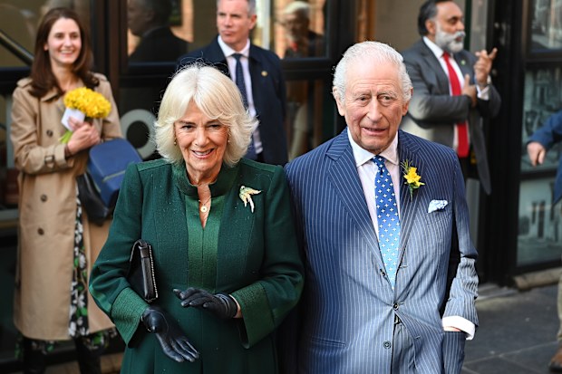 BELFAST, NORTHERN IRELAND - MARCH 19: King Charles III and Queen Camilla are serenaded with a sea shanty as they visit Commercial Court during an official visit to Northern Ireland on March 19, 2025 in Belfast, Northern Ireland. (Photo by Charles McQuillan/Getty Images)
