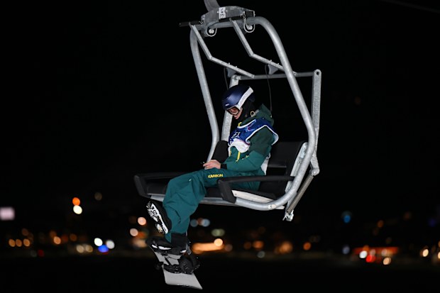 Scotty James rides the ski lift at halfpipe training in Livigno.