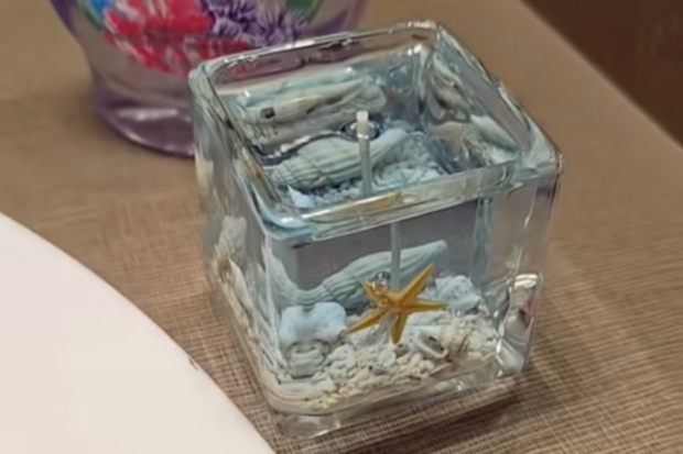 Ocean gel candle sitting on a bathroom counter
