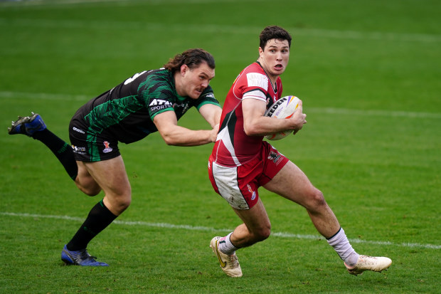 Ireland's Robbie Mulhern (left) and Lebanon's Mitchell Moses battle for the ball during the Rugby League World Cup group A match at the Leigh Sports Village, Leigh. Picture date: Sunday October 23, 2022. (Photo by Mike Egerton/PA Images via Getty Images)