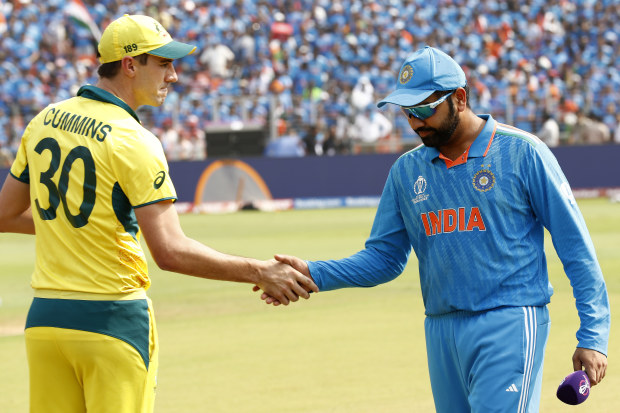 Pat Cummins of Australia and Rohit Sharma of India shake hands ahead of the ICC Men's Cricket World Cup India 2023 Final between India and Australia at Narendra Modi Stadium on November 19, 2023 in Ahmedabad, India. (Photo by Darrian Traynor-ICC/ICC via Getty Images)
