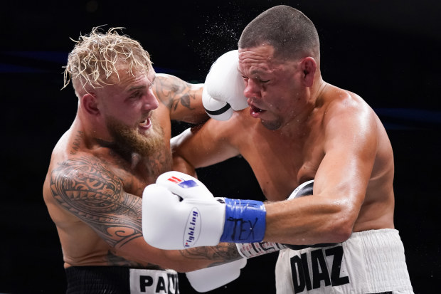 DALLAS, TEXAS - AUGUST 05: Jake Paul, left, and Nate Diaz, right, trade punches during the third round of their fight at the American Airlines Center on August 05, 2023 in Dallas, Texas. (Photo by Sam Hodde/Getty Images)