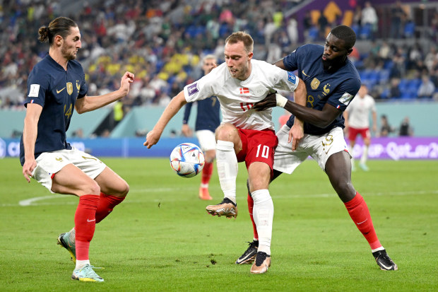 Christian Eriksen of Denmark controls the ball under pressure of Adrien Rabiot and Dayot Upamecano of France during the FIFA World Cup Qatar 2022 Group D match between France and Denmark at Stadium 974 on November 26, 2022 in Doha, Qatar. (Photo by Clive Mason/Getty Images)
