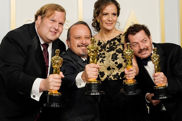 Phillip Bladh, Carlos Cortes, Michellee Couttolenc and Jaime Baksht, winners of the award for best sound for "Sound of Metal".