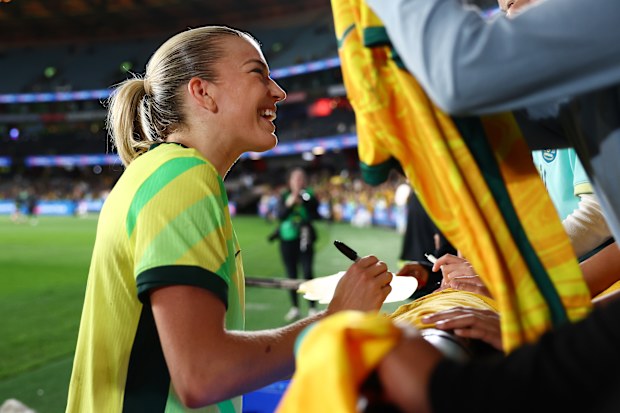 Charlotte Grant of Australia signs fans items during the International Friendly match between Australia Matildas and Argentina at Marvel Stadium on May 30, 2025 in Melbourne, Australia.