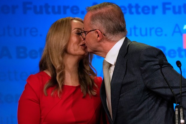 Labor Party leader Anthony Albanese, right, kisses his partner partner Jodie Haydon while thanking supporters at a Labor Party event in Sydney, Australia, Sunday, May 22, 2022