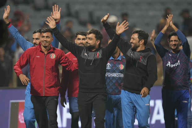 Afghanistan's players acknowledge the crowd after winning their match against Sri Lanka.