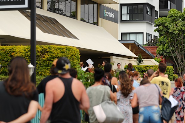 People queue outside Centrelink in Pam Beach on March 23, 2020 in Various Cities, Australia.
