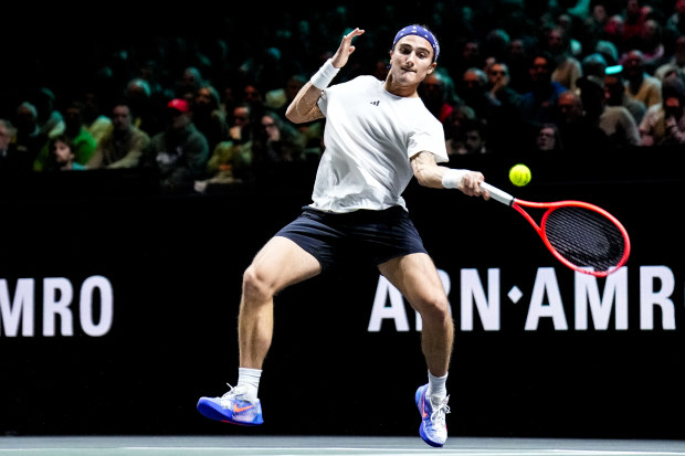 Mattia Bellucci of Italy plays a forehand.