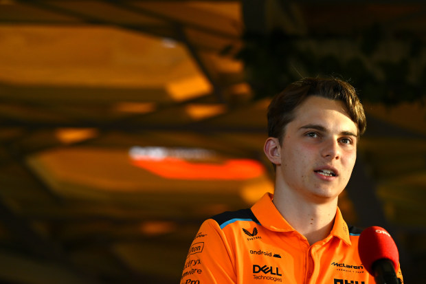 Oscar Piastri of Australia and McLaren talks to the media.