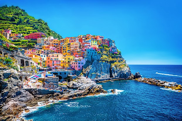 Beautiful colorful cityscape on the mountains over Mediterranean sea, Europe, Cinque Terre, traditional Italian architecture.