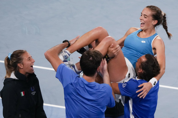 Italy's Lucia Bronzetti, centre, is held aloft by teammates after defeating Valentini Grammatikopoulou of Greece in their semifinal match at the United Cup tennis event in Sydney, Australia, Saturday, Jan. 7, 2023.
