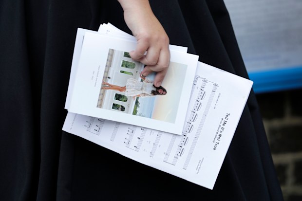 Sheet music and an order of service held by Natalie Rushdie as she attends the funeral of Dame Deborah James at St Mary's Church on July 20, 2022 in Barnes, England