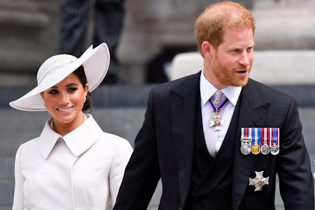 LONDON, ENGLAND - JUNE 03:   Prince Harry, Duke of Sussex, and Meghan, Duchess of Sussex after attending the National Service of Thanksgiving at St Paul's Cathedral during the Queen's Platinum Jubilee celebrations on June 3, 2022 in London, England. The Platinum Jubilee of Elizabeth II is being celebrated from June 2 to June 5, 2022, in the UK and Commonwealth to mark the 70th anniversary of the accession of Queen Elizabeth II on 6 February 1952. (Photo by Toby Melville - WPA Pool/Getty Images)