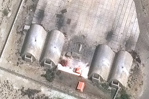 In this satellite image provided by Vantor, damage from precision airstrikes on aircraft shelters is seen at the Konarak Airbase, Iran, Sunday, March 1, 2026. 