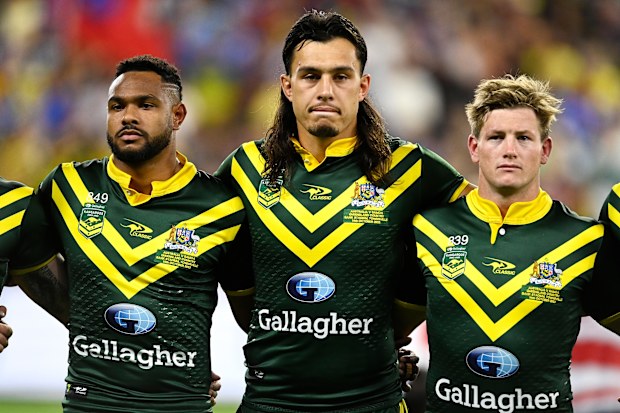Hamiso Tabuai-Fidow, Tino Fa'asuamaleaui and harry Grant line up for the national anthems during the Pacific Championship match between Australia Kangaroos and Samoa at Queensland Country Bank Stadium on October 14, 2023 in Townsville, Australia. (Photo by Ian Hitchcock/Getty Images)