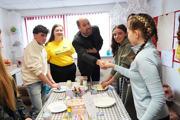 WIDNES, ENGLAND - FEBRUARY 5: Prince William, Prince of Wales and Patron of Child Bereavement UK, meets children who have been supported by the charity during a visit to the charity service to see its work in action, making a positive difference to bereaved families, on February 5, 2025 in Widnes, England. Child Bereavement UK supports children and young people up to the age of 25 when someone important to them has died or is not expected to live, and parents and the wider family when a baby or 