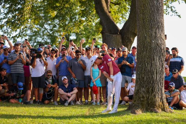Team Captain Cameron Smith of Punch GC plays his second shot on the 18th hole as fans look on during Day Three of the LIV Golf Invitational - Chicago at Rich Harvest Farms on September 18, 2022 in Sugar Grove, Illinois. (Photo by Chris Trotman/LIV Golf via Getty Images)