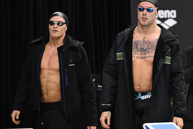 Cody Simpson and Kyle Chalmers of Australia walk out to compete in the men's 100m butterfly.
