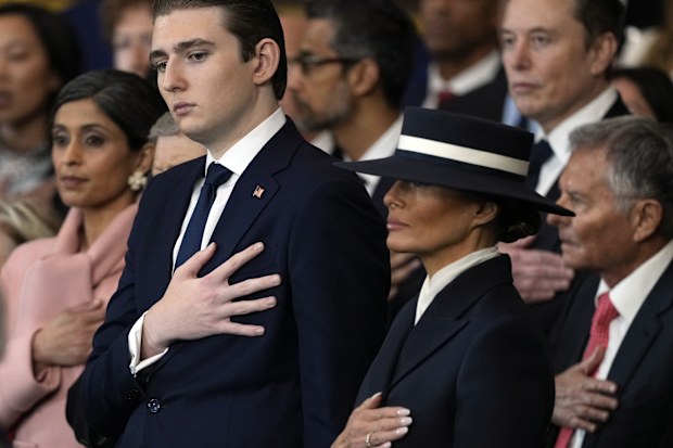 Barron Trump and first lady Melania Trump listen to Christopher Macchio sing during the 60th Presidential Inauguration in the Rotunda of the U.S. Capitol in Washington, Monday, Jan. 20, 2025. 