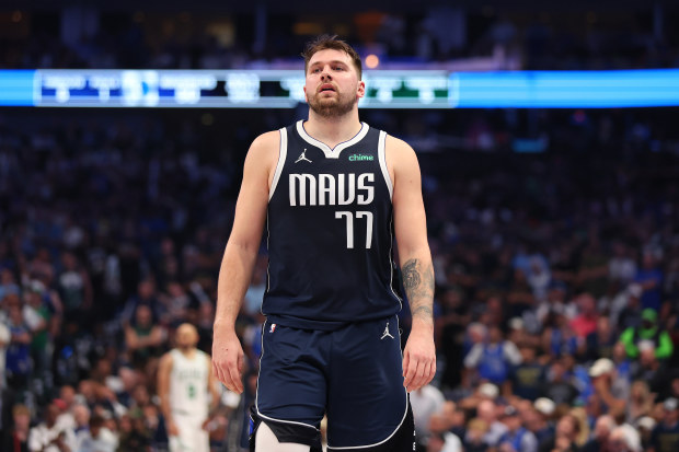 Luka Doncic of the Dallas Mavericks walks across the court in the second quarter.