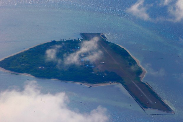 This photo taken from a C-130 transport plane shows Thitu Island off the South China Sea, April 21, 2017. 