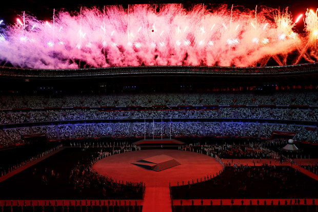 Fireworks erupt above the stadium during the Closing Ceremony of the Tokyo 2020 Olympic Games.