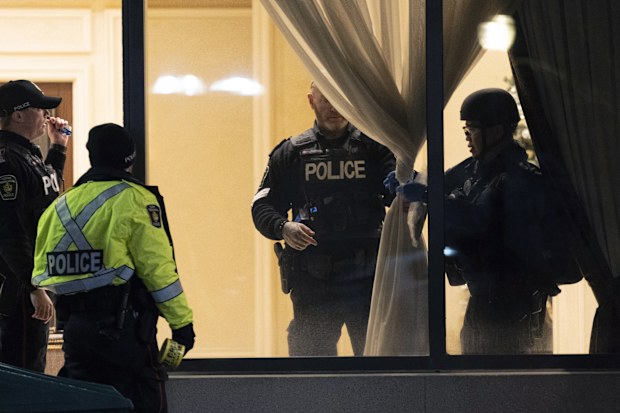 York Regional Police tactical officers work the scene of a fatal shooting in Vaughan, Ontario. Authorities said multiple people were shot and killed in a condominium unit in the Toronto suburb and the gunman was killed by police.  
