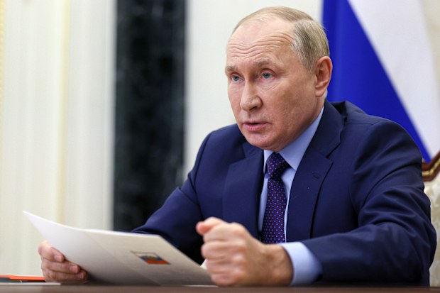Russian President Vladimir Putin with a clenched fist. 