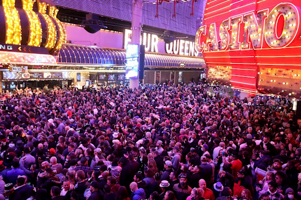 Revellers celebrate on New Years Eve at the Fremont Street Experience in downtown Las Vegas Friday, Dec. 31, 2021. 