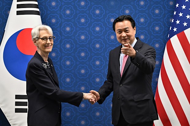 South Korea's First Vice Foreign Minister Cho Hyun-dong, right, shakes hands with U.S. Deputy Secretary of State Wendy Sherman during their meeting at the Foreign Ministry in Seoul Tuesday, June 7, 2022 