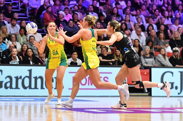 Steph Wood (left) and Liz Watson (middle) of the Australian Diamonds during game two of the Constellation Cup series between the New Zealand Silver Ferns.