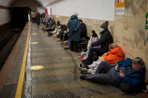 People lie in the Kyiv subway, using it as a bomb shelter in Kyiv, Ukraine, Thursday, Feb. 24, 2022. 