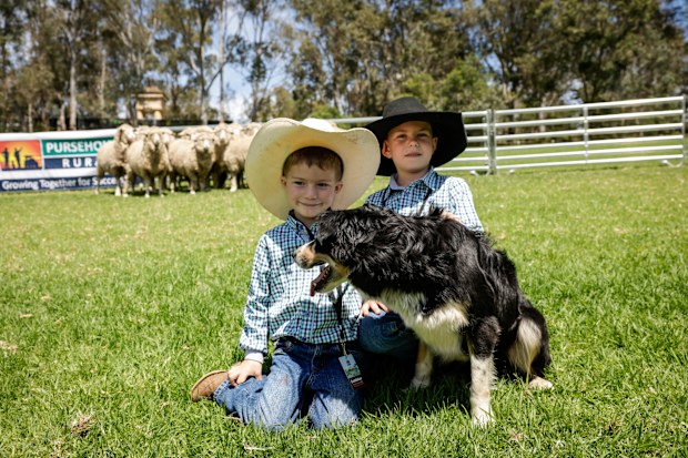 Tanner Wilkinson (R), 4, and Jordan Wilkinson, 6, await the arrival of King Charles III at the venue of a community BBQ on October 22, 2024 in Sydney, Australia. The King's visit to Australia will be his first as Monarch, and CHOGM in Samoa will be his first as Head of the Commonwealth.  