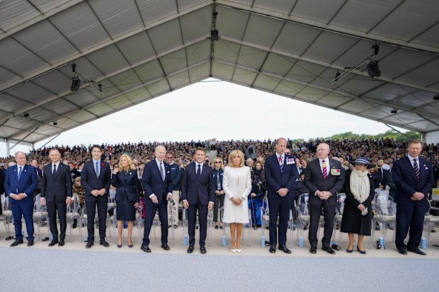 (L-R) Prince Albert of Monaco, Poland's President Andrzej Duda, Canadian Prime Minister Justin Trudeau, first lady Jill Biden, US President Joe Biden, French President Emmanuel Macron and his wife Brigitte Macron, Prince William, Governor-General of Australia David Hurley, his wife Linda Hurley and Luxembourg Grand Duke Henri 