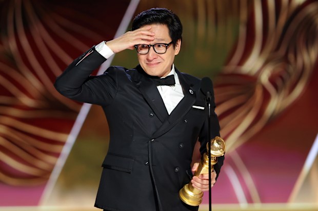 Ke Huy Quan accepts the Best Supporting Actor in a Motion Picture award for "Everything Everywhere All at Once" onstage at the 80th Annual Golden Globe Awards