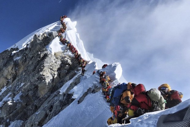 A long queue of mountain climbers line a path on Mount Everest, on May 22 last year. The photo of the world's highest mountain packed with climbers attracted worldwide attention.