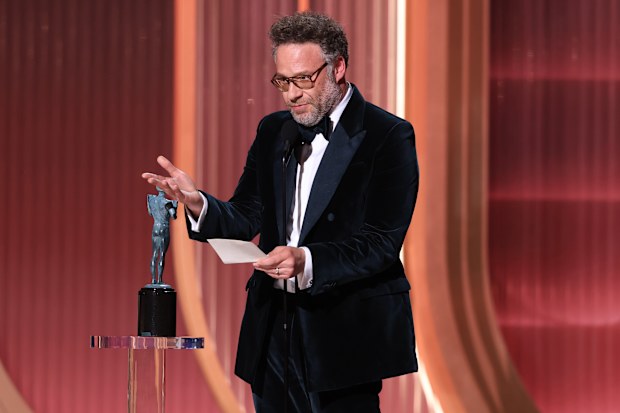 Seth Rogen accepts on behalf of the posthumous award for Catherine O'Hara for the Outstanding Performance by a Female Actor in a Comedy Series Award for "The Studio" onstage during the 32nd Annual Actor Awards at Shrine Auditorium and Expo Hall on March 01, 2026 in Los Angeles, California.