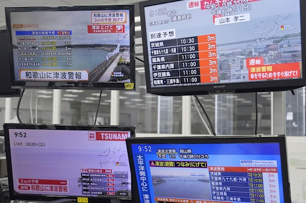 TV monitors show news flash after a powerful earthquake in Russia's Far East prompted tsunami warnings in parts of Japan, in Osaka, western Japan Wednesday, July 30, 2025. (Kai Naito/Kyodo News via AP)