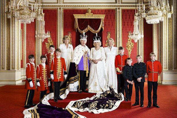 King Charles III and Queen Camilla with their Pages of Honour and Ladies in Attendance on the day of the coronation in the Throne Room at Buckingham Palace. Pictured (left to right) Ralph Tollemache, Lord Oliver Cholmondeley, Nicholas Barclay, Prince George of Wales, the Marchioness of Lansdowne, the Queen's sister Annabel Elliot, the Queen's grandson Freddy Parker Bowles, the Queen's great-nephew Arthur Elliot, and the Queen's grandsons Gus Lopes and Louis Lopes.