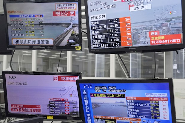 TV monitors show news flash after a powerful earthquake in Russia's Far East prompted tsunami warnings in parts of Japan, in Osaka, western Japan Wednesday, July 30, 2025. (Kai Naito/Kyodo News via AP)
