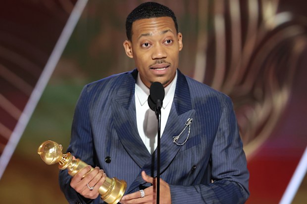 Tyler James Williams accepts the Best Supporting Actor in a Television Series  Musical-Comedy or Drama award for "Abbott Elementary" onstage at the 80th Annual Golden Globe Awards 