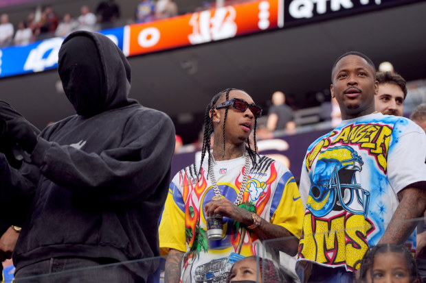Kanye West, Tyga, and YG attend Super Bowl LVI at SoFi Stadium on February 13, 2022 in Inglewood, California. 