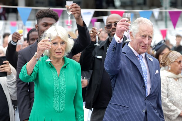 Camilla, Duchess of Cornwall and Prince Charles, Prince Of Wales cheers with glasses of champagne at the Big Jubilee Lunch at The Oval on June 5, 2022 in London, England.  