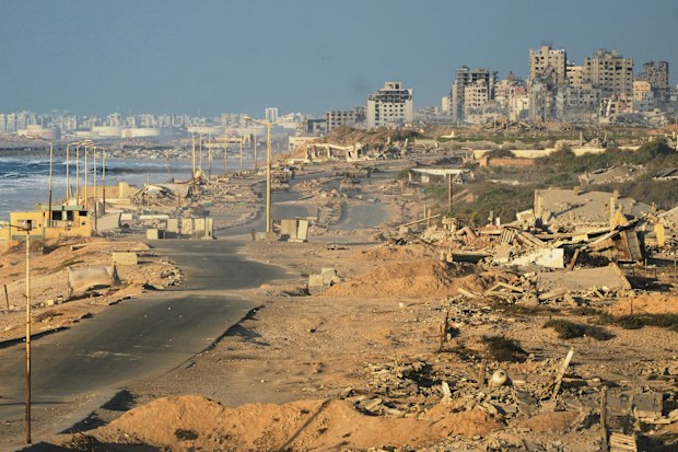 Israeli tanks are positioned on the coastal road leading to Gaza City near Wadi Gaza, in the central Gaza Strip, Thursday, Oct. 9, 2025. 