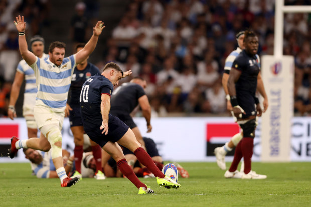 George Ford of England kicks a drop goal.