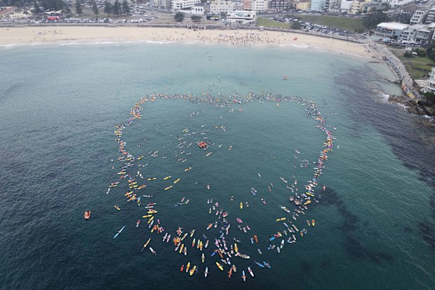 The parents of 12-year-old shark attack victim Nico Antic joined a paddle out in his honour in Bondi.
