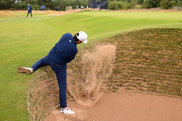Santiago de la Fuente of Mexico plays a bunker shot on the 11th hole during a practice round prior to The 152nd Open championship at Royal Troon on July 16, 2024 in Troon, Scotland. (Photo by Ross Kinnaird/Getty Images)